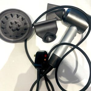 The Dyson Supersonic™ hair dryer with 2 styling tools